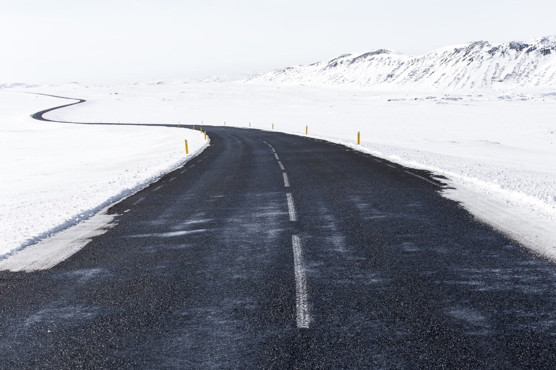 An icy road with curves ahead.